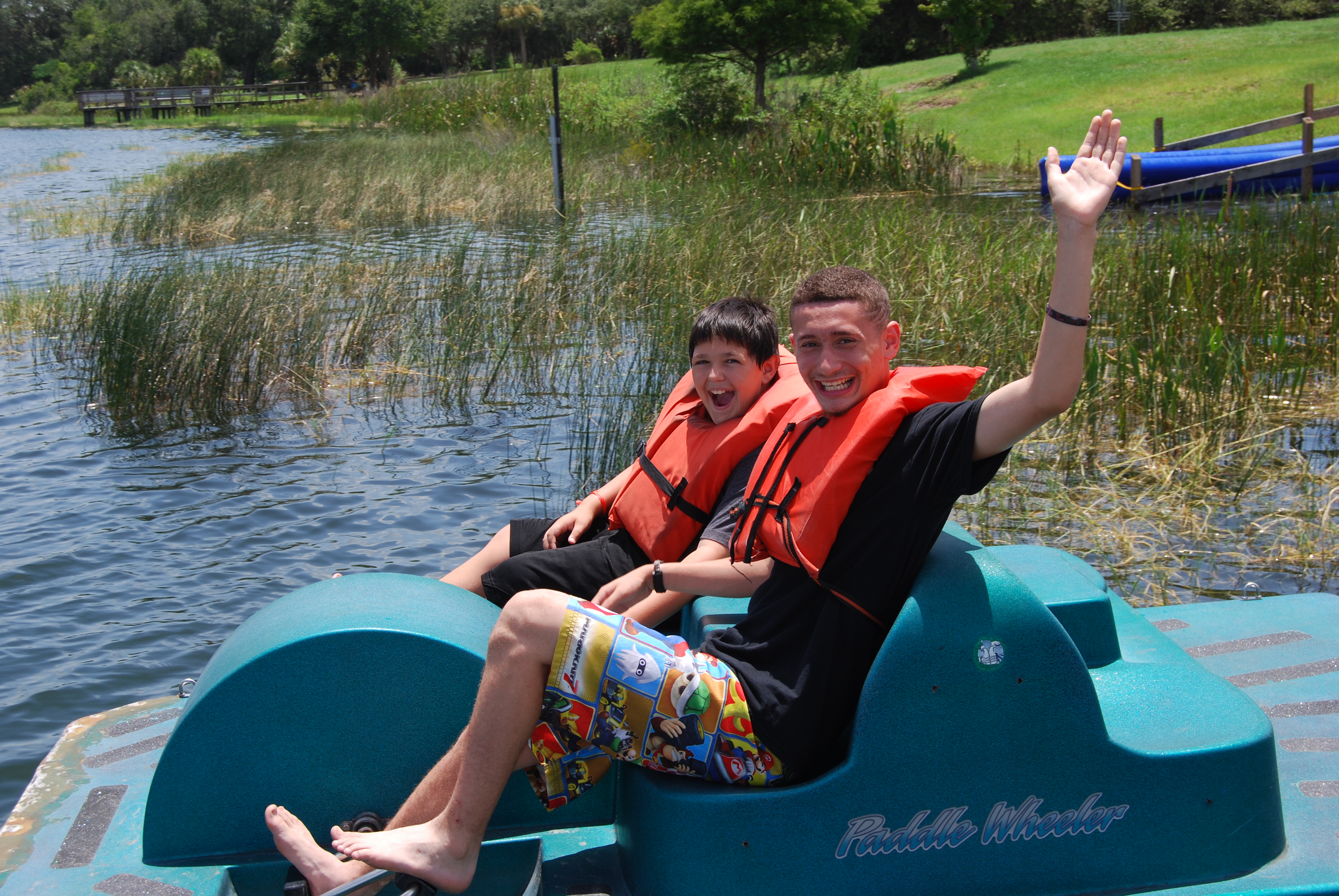 Two campers enjoy a paddle boat